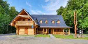 a log cabin with a gambrel roof at Srub u Medvěda in Nový Jičín