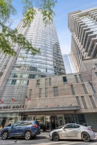 two cars parked in front of a building at Great Located Studio perfect for 2 with parking in Toronto