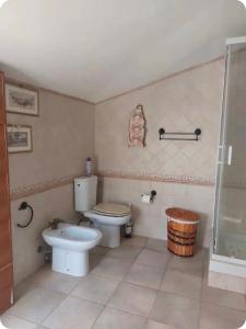 a bathroom with a toilet and a shower at Casa Wendy in Carloforte +4 photos
