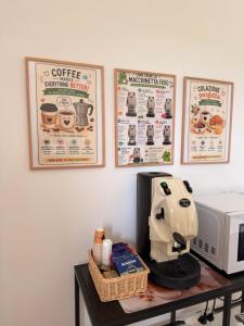 a table with a coffee machine and a microwave at B&B Luna Verde in Mercato San Severino
