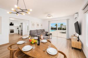 a dining room and living room with a table and chairs at Villa Yaiza Secret 1 in Yaiza
