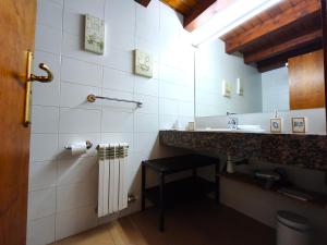 a white bathroom with a sink and a counter at AC Apartaments Solana Ransol in Ransol +21 photos