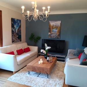 a living room with two couches and a coffee table at Pearly Maison Central Ruffec in Ruffec