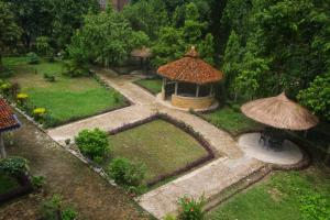 an aerial view of a garden with a gazebo at Mr. B's Place in Bhurkīā +32 photos