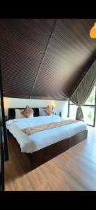 a bedroom with a large bed in a room at THE RiYASAT SARISKA in Ajabgarh