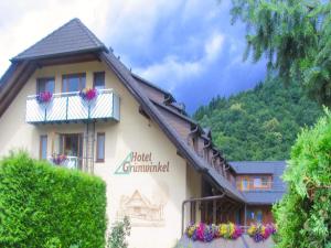 a building with a sign that reads hotel cummund at Hotel Grünwinkel in Oberharmersbach