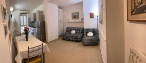 a small living room with a table and a couch at Villa Paradiso in Gaeta +171 photos