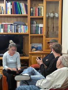 a group of people sitting in a living room at konaku in Tomin