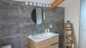 a bathroom with a sink and a mirror at Au petit moulin in Issigeac +24 photos