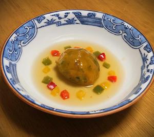 a blue and white bowl of food with vegetables in it at IZUNA INN & SPA - the veggie delights in Ito