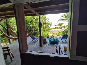 a view of a porch with a hammock and chairs at Casa Origen in El Valle +30 photos
