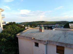 a bottle sitting on the roof of a building at 3 Zimmer Wohnung in Sutomore