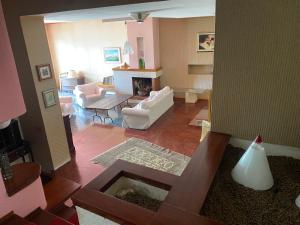 a living room with a couch and a fireplace at Vista Mare a 300 mt dalla spiaggia in Cariati