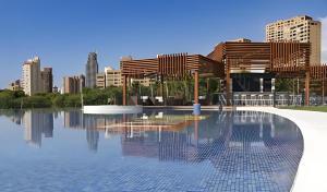 a swimming pool with a city skyline in the background at Benidorm Luxury Residential in Benidorm