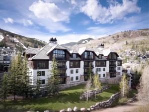 an aerial view of a large building with mountains in the background at The Residences at Mountain Lodge by Hyatt Vacation Club in Beaver Creek