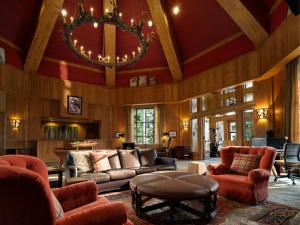 a living room filled with furniture and a chandelier at The Residences at Mountain Lodge by Hyatt Vacation Club in Beaver Creek