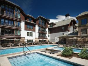 a swimming pool in front of a building at The Residences at Mountain Lodge by Hyatt Vacation Club in Beaver Creek