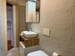 a bathroom with a sink and a toilet at The Nest in Mandello del Lario +4 photos