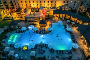 an overhead view of a pool at a hotel at night at Pub, Hot Tub, Game Room, Monkey Island Waterfront in Afton