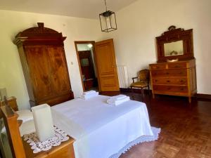 a bedroom with a bed and a dresser and a mirror at Vista Mare a 300 mt dalla spiaggia in Cariati +23 photos