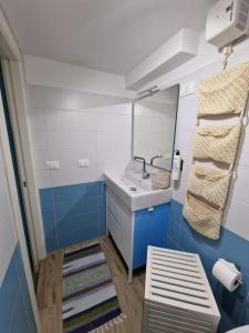 a bathroom with a sink and a mirror at La Rinascita HOUSE in Francavilla al Mare +19 photos