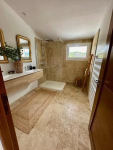 a bathroom with a shower and a sink at Cruciata in Pietrosella