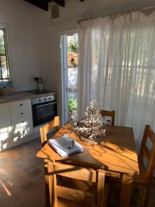 a kitchen with a wooden table with a laptop on it at Gorgeous Apartment in Jesús in Nuestra Señora de Jesus