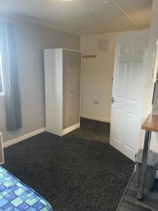 an empty room with a closet and a door at Jayden house in Middlesbrough