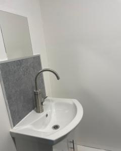 a white sink in a white bathroom at Jayden house in Middlesbrough