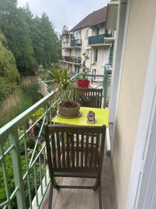 a table on a balcony with a plant on it at Studio Disney Paris in Bailly-Romainvilliers