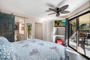 a bedroom with a bed and a ceiling fan at KONA - Royal Kahili B205 End Unit - Gorgeous Views in Kailua-Kona +39 photos