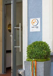 a front door of a building with a sign on it at Mühlenkamp Hotel & Gastronomie in Oelde