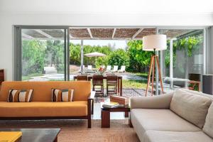 a living room with a couch and a table at Quinta da Berlica - Alentejo in Estremoz