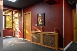 a hallway with red walls and a yellow door at Kervan Hotel Pendik in Istanbul