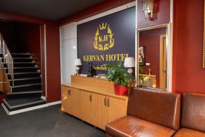 a waiting room with a kerwegian hotel sign on the wall at Kervan Hotel Pendik in Istanbul