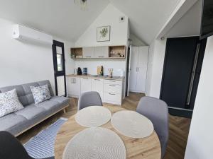 a living room with a couch and a table at STAW się tu in Młyny