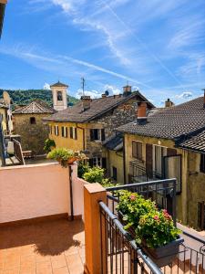 a balcony with a view of an old building at Cà di Gabriel in Miglieglia