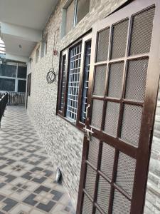 a door to a building with a tile floor at Shree mangalam homestay in Bhīm Tāl