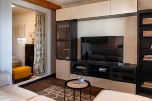 a living room with a large flat screen tv at Anties Namai in Juodkrantė