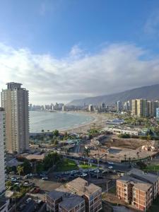 an aerial view of a city with a beach and buildings at Studio Distrito Cavancha 2 in Iquique