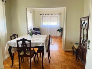 a dining room with a table and some chairs at Casa de férias in Monte +11 photos