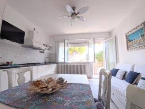 a kitchen with a table with a bowl of food on it at Maréthias in Punta Marina
