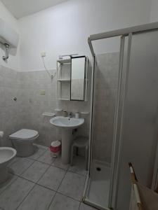 a bathroom with a toilet and a sink and a shower at NumanaPaceeMare in Numana +71 photos