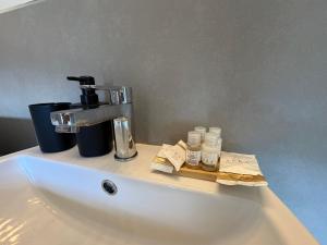 a sink with a faucet on top of it at Appartamento San Rocco in Intra