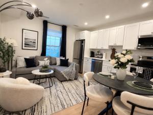 a living room with a couch and a table at Fox Point Landing Residences in Providence