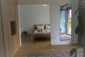 a living room with a bed and a window at Danuvius18 in Obernzell