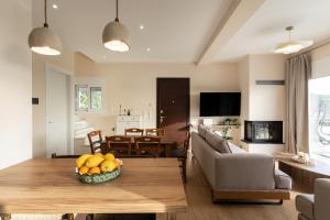 a living room with a table with fruit on it at Casa Elaia in Pylos