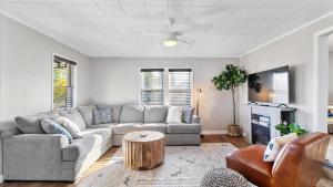 a living room with a couch and a table at West Bench Retreat in Red Lodge