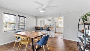 a dining room and kitchen with a wooden table and chairs at West Bench Retreat in Red Lodge