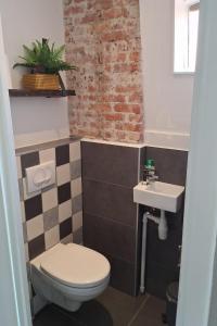 a bathroom with a toilet and a sink at Upstairs Stay Alkmaar in Alkmaar +23 photos